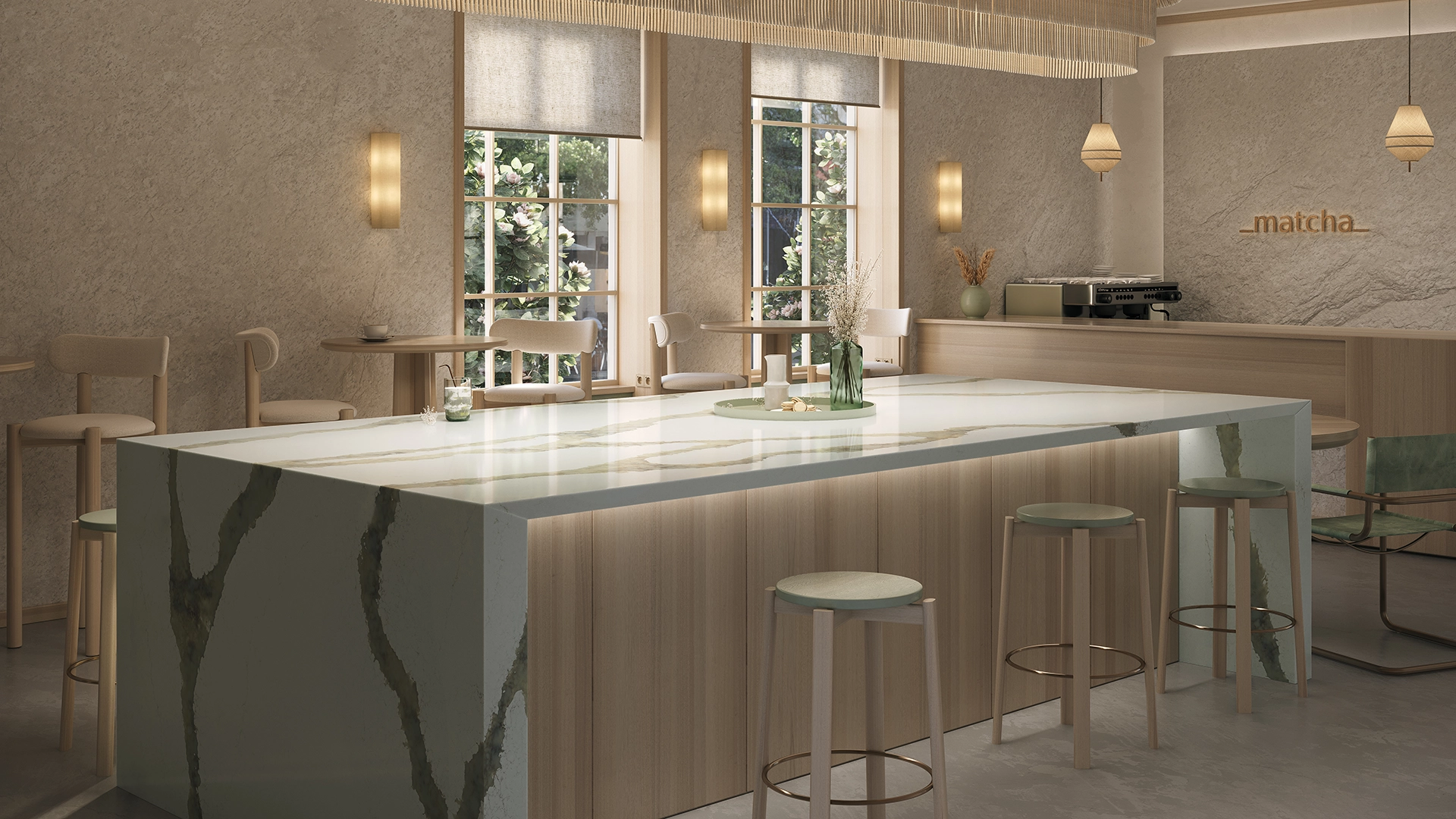 Island bar with a white Calacatta Thyme Caesarstone ICON waterfall edge counter, large woven rattan pendant lighting, and light wood paneling.