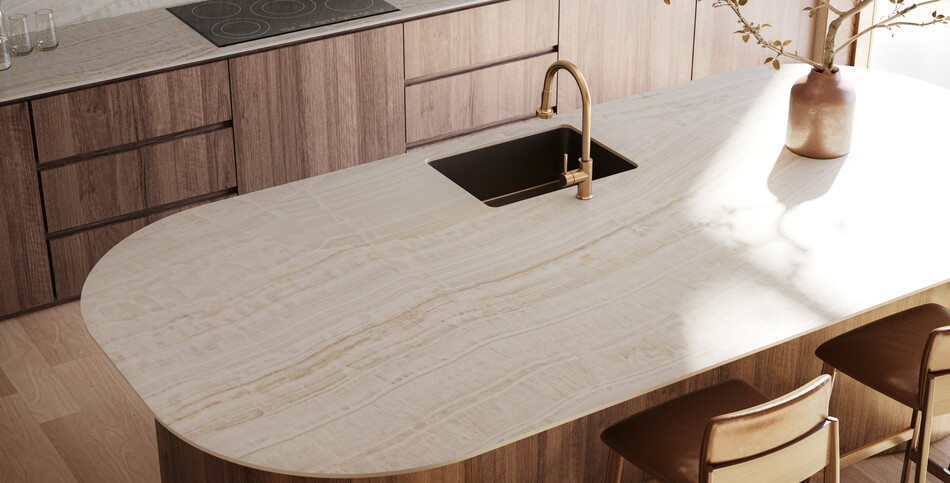 Warm kitchen featuring light wood, fluted paneling on Onyxa porcelain island with a matte finish, and textured walls.