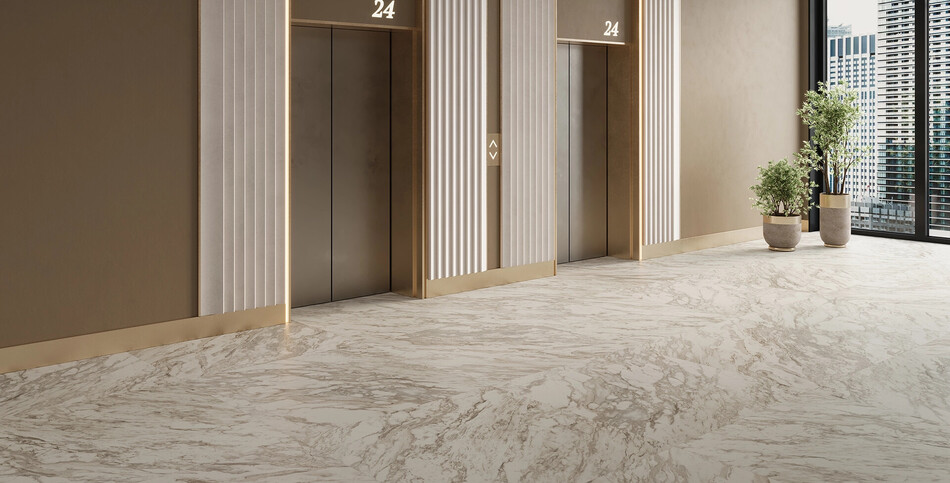 Dolcivio Caesarstone porcelain used as a high-traffic marble-look flooring in a commercial lobby.
